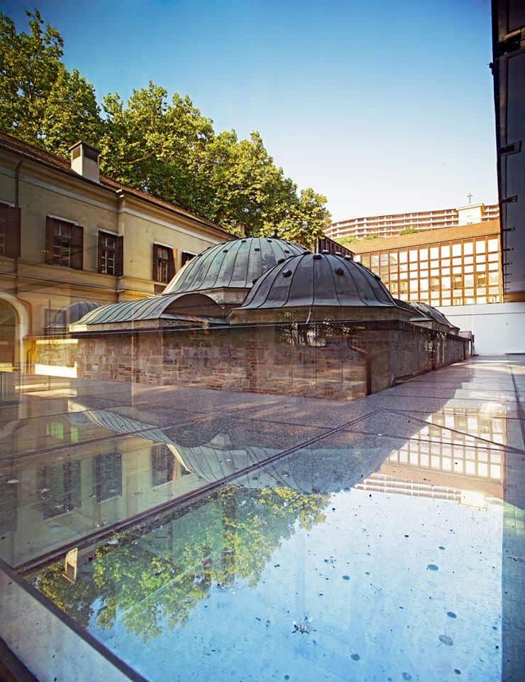 The historic exterior domes of Veli Bej protected by modern glass