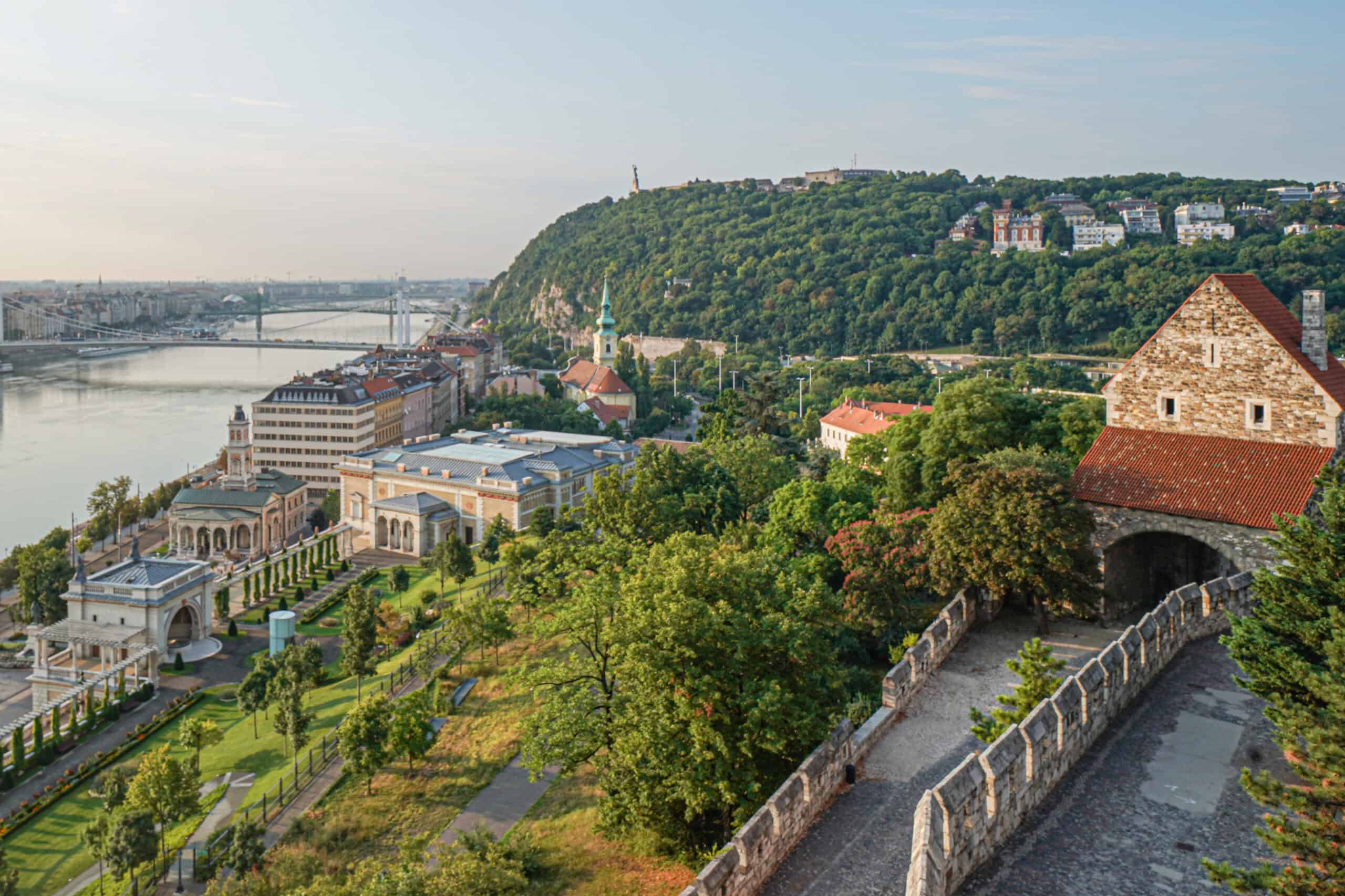 A wide panoramic view of the Hungarian Parliament and the Danube from the Fishermen's Bastion