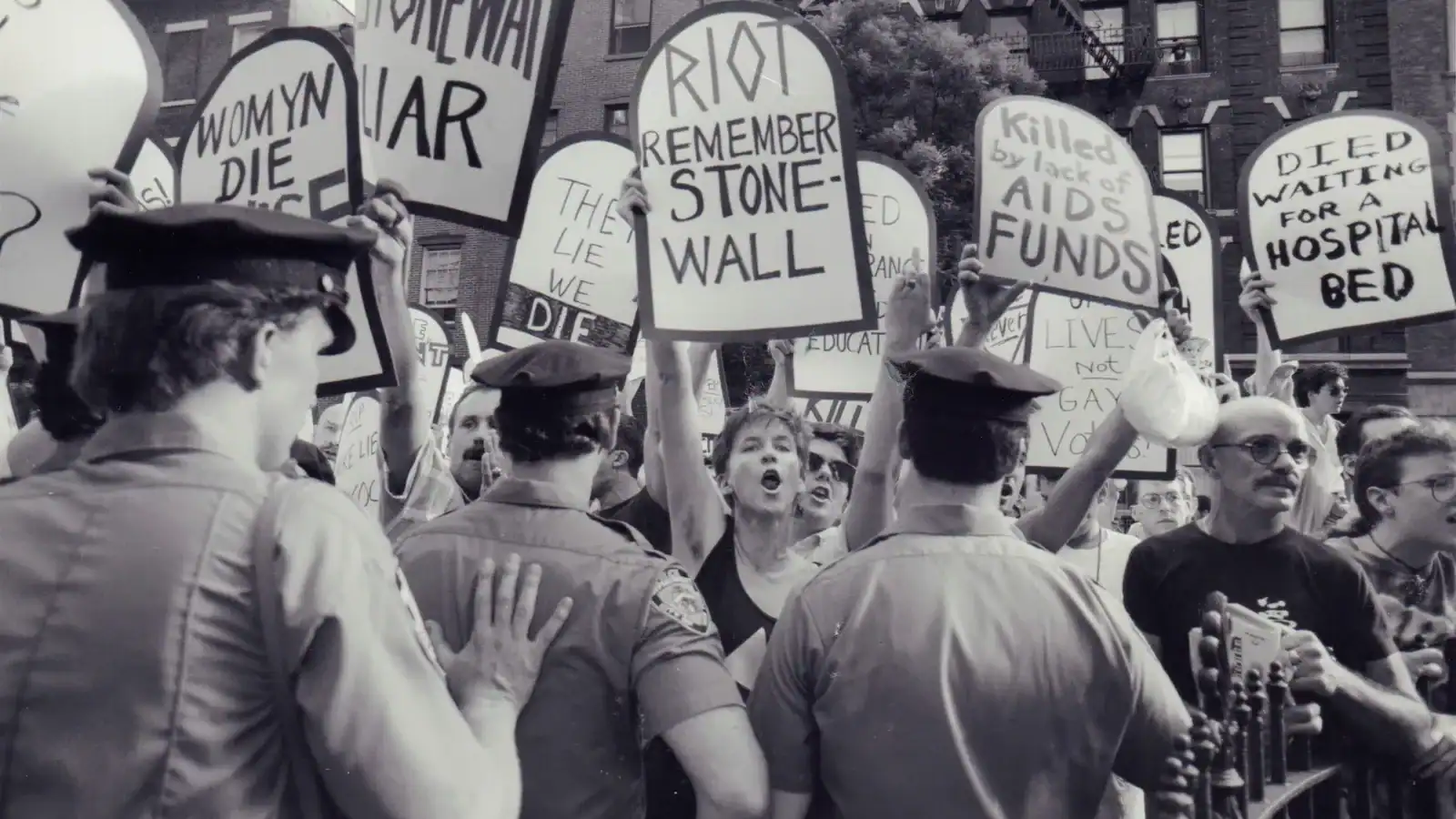 Vintage black and white photo of activists during an early Pride demonstration