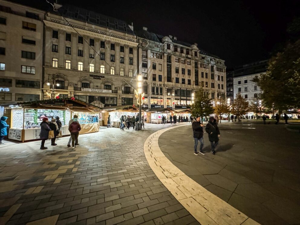 Wide view of the bustling Vörösmarty Square Christmas market