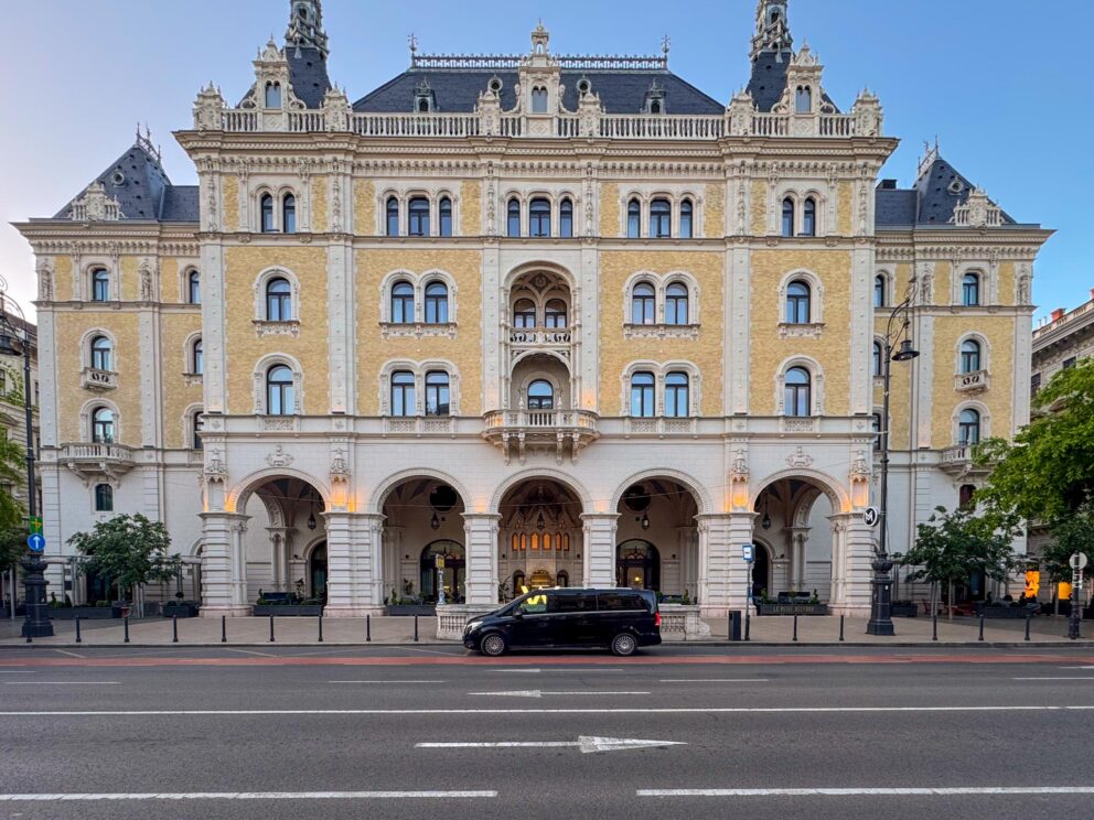 A luxury van parked in front of the W Budapest Hotel entrance