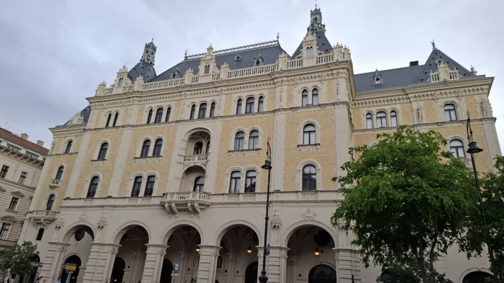 The magnificent newly cleaned cream-colored facade of the grand historic Drechsler Palace building