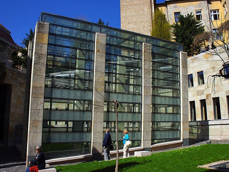 Thousands of victims' names laser-engraved perfectly into a thick glass memorial wall